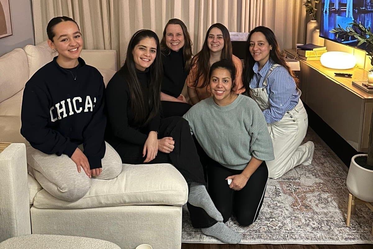 The DG Women group gathered together in a living room